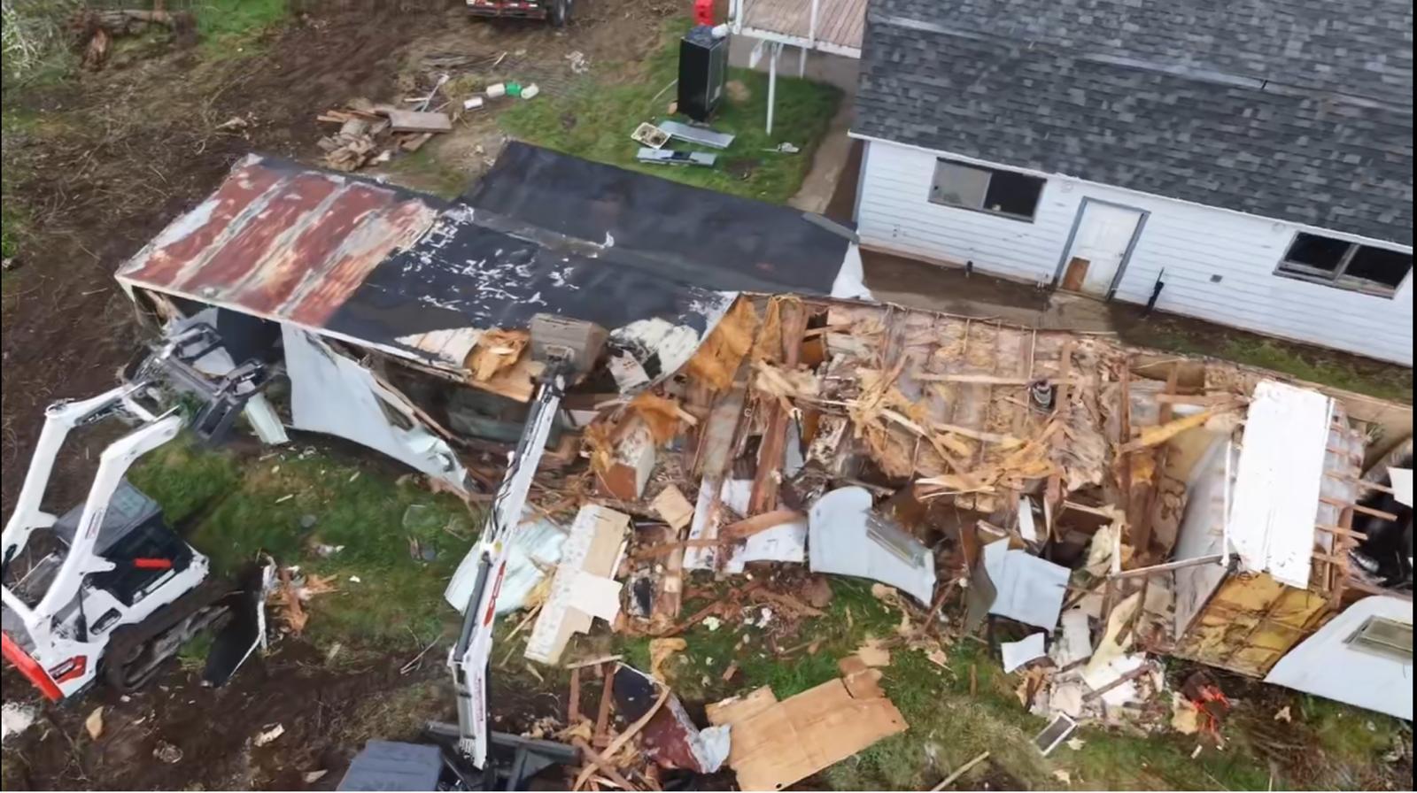 Local team clearing a residential driveway after a storm
